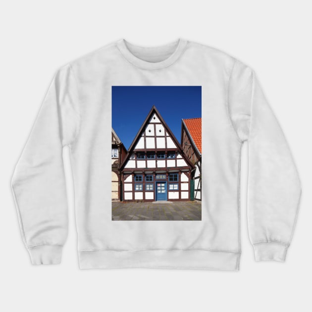 Historic half-timbered house on the church square, Nienburg an der Weser, Lower Saxony, Germany, Europe Crewneck Sweatshirt by Kruegerfoto